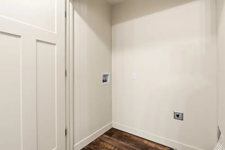 Wood-finish flooring with light-toned walls and crisp white trim