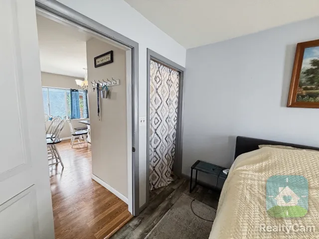 Wood-finish flooring and light gray wall paint