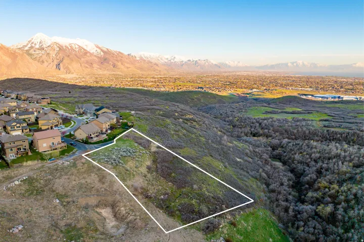 Expansive lot with surrounding natural landscape and distant mountain ranges
