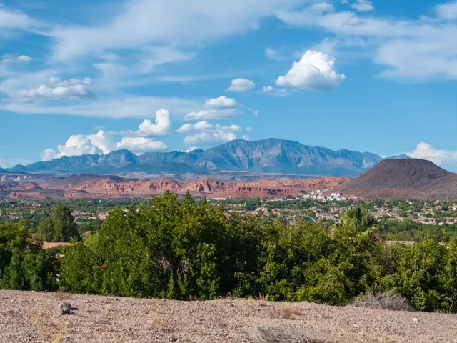 Mountain backdrop with a valley and distant community structures