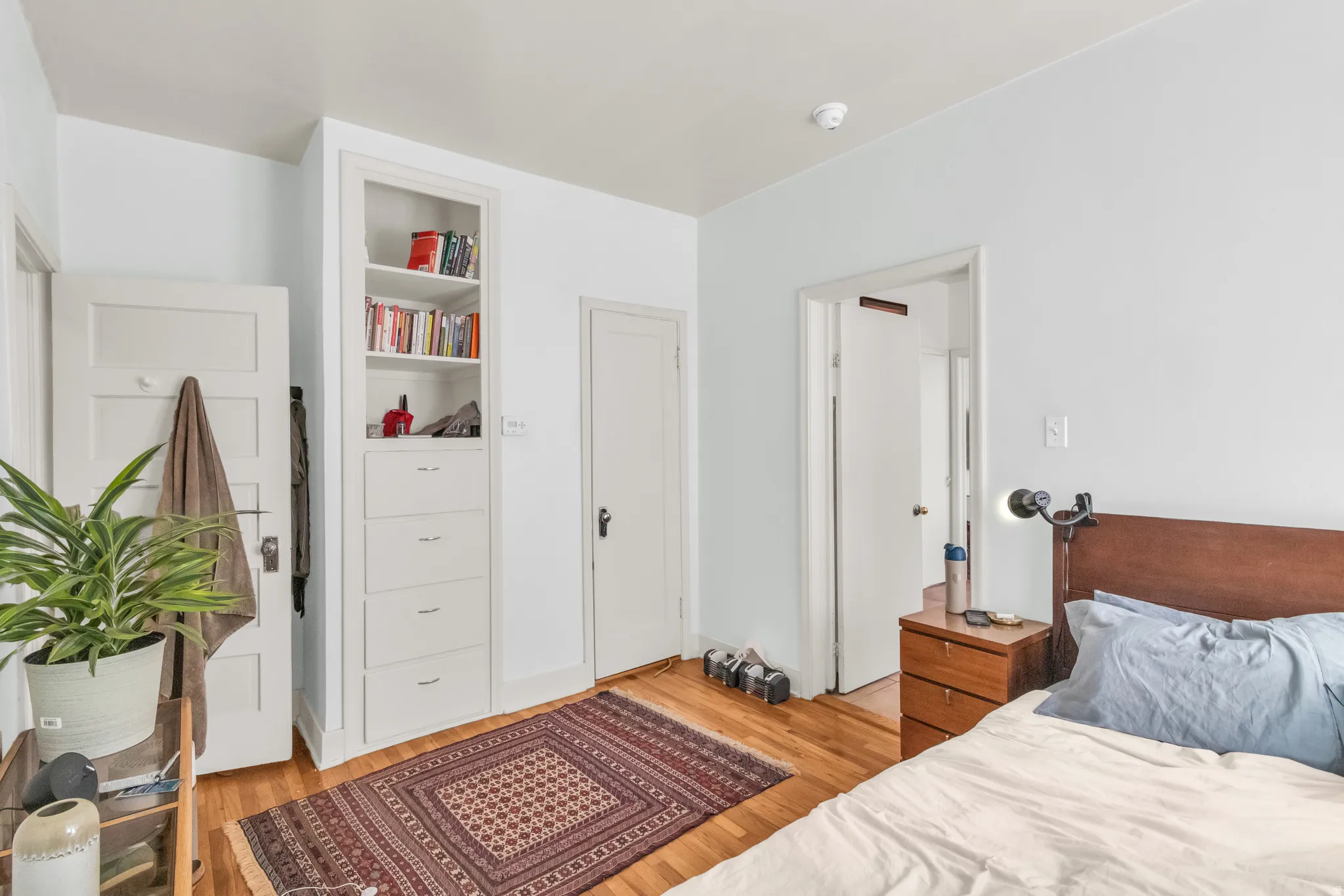 Hardwood flooring, built-in shelving, built-in drawers, and solid core doors