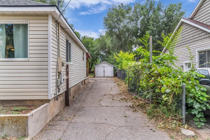 Paved driveway offering access to the detached garage