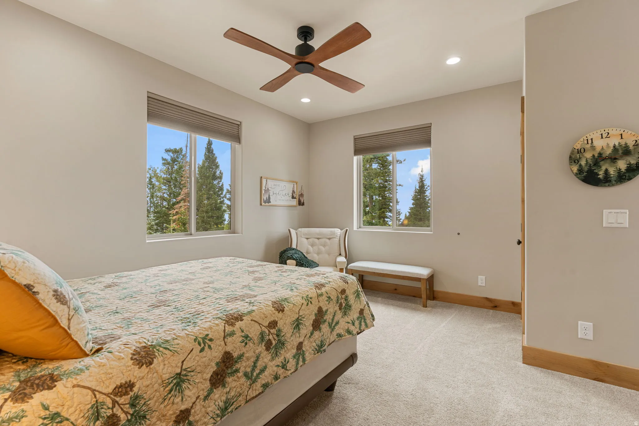 Recessed lighting, wood-finish ceiling fan, wood-finish trim, light-colored walls, and carpet flooring