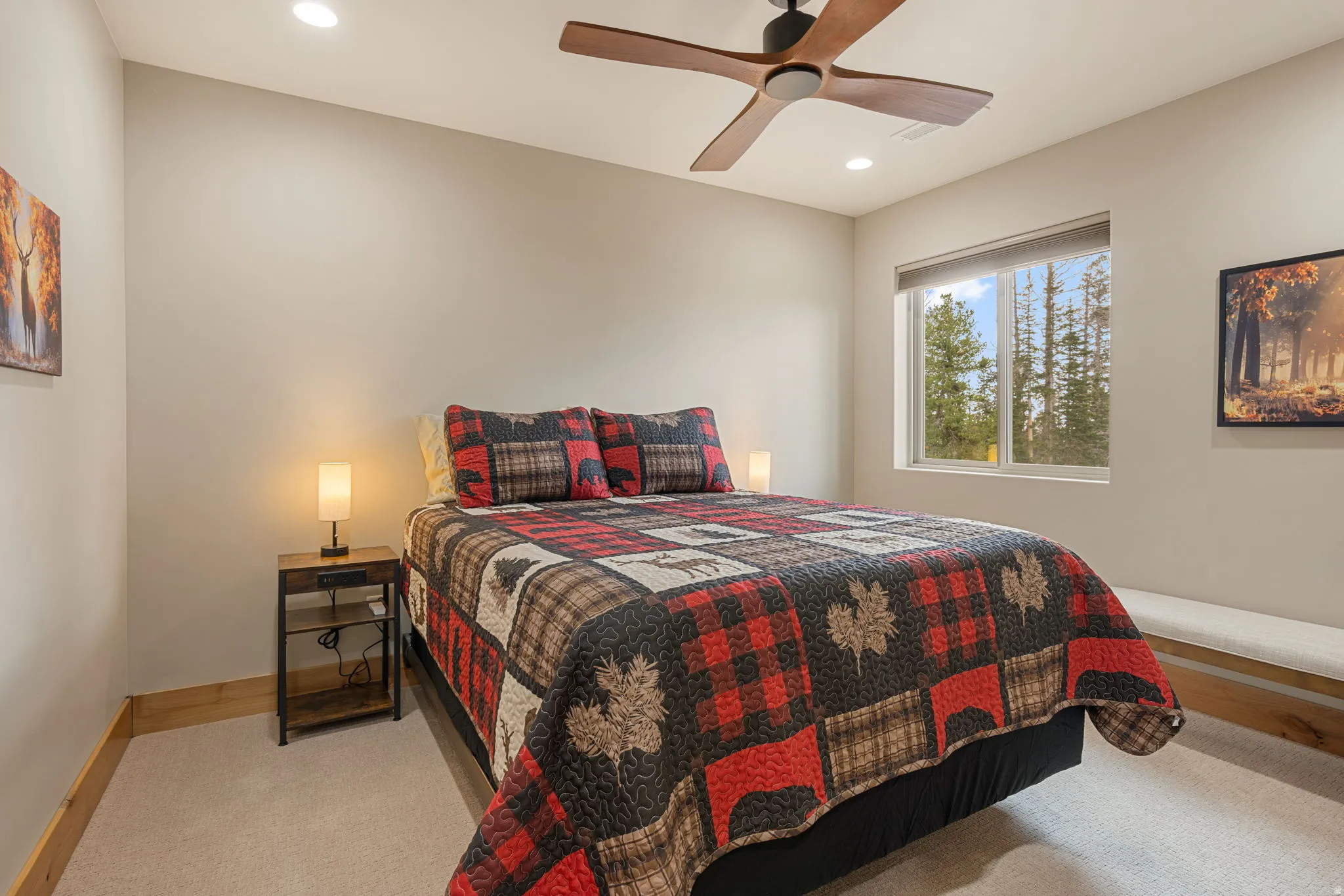 Recessed lighting illuminates the space, complemented by a ceiling fan