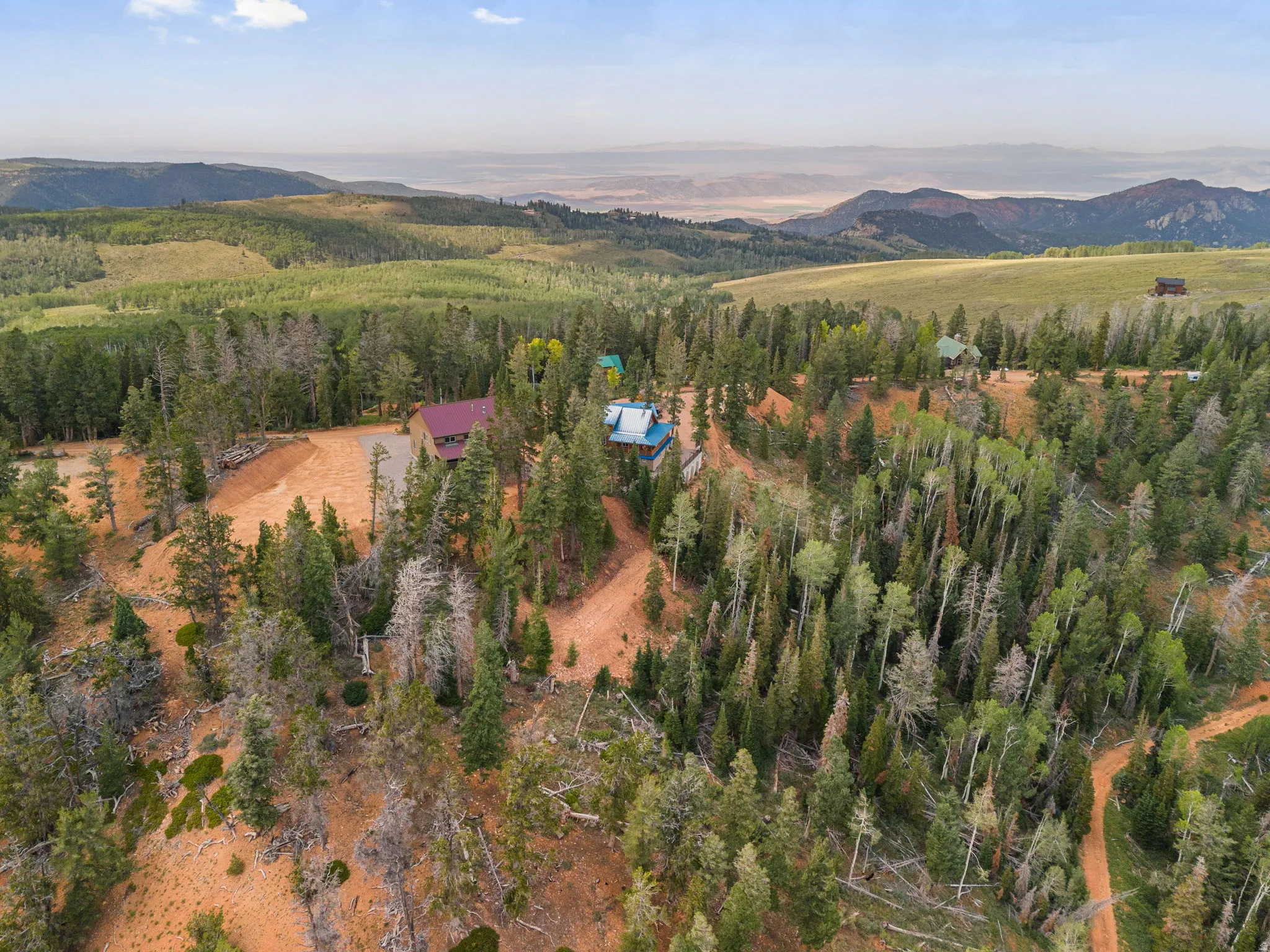 Expansive natural landscape with varied terrain and distant mountain ranges