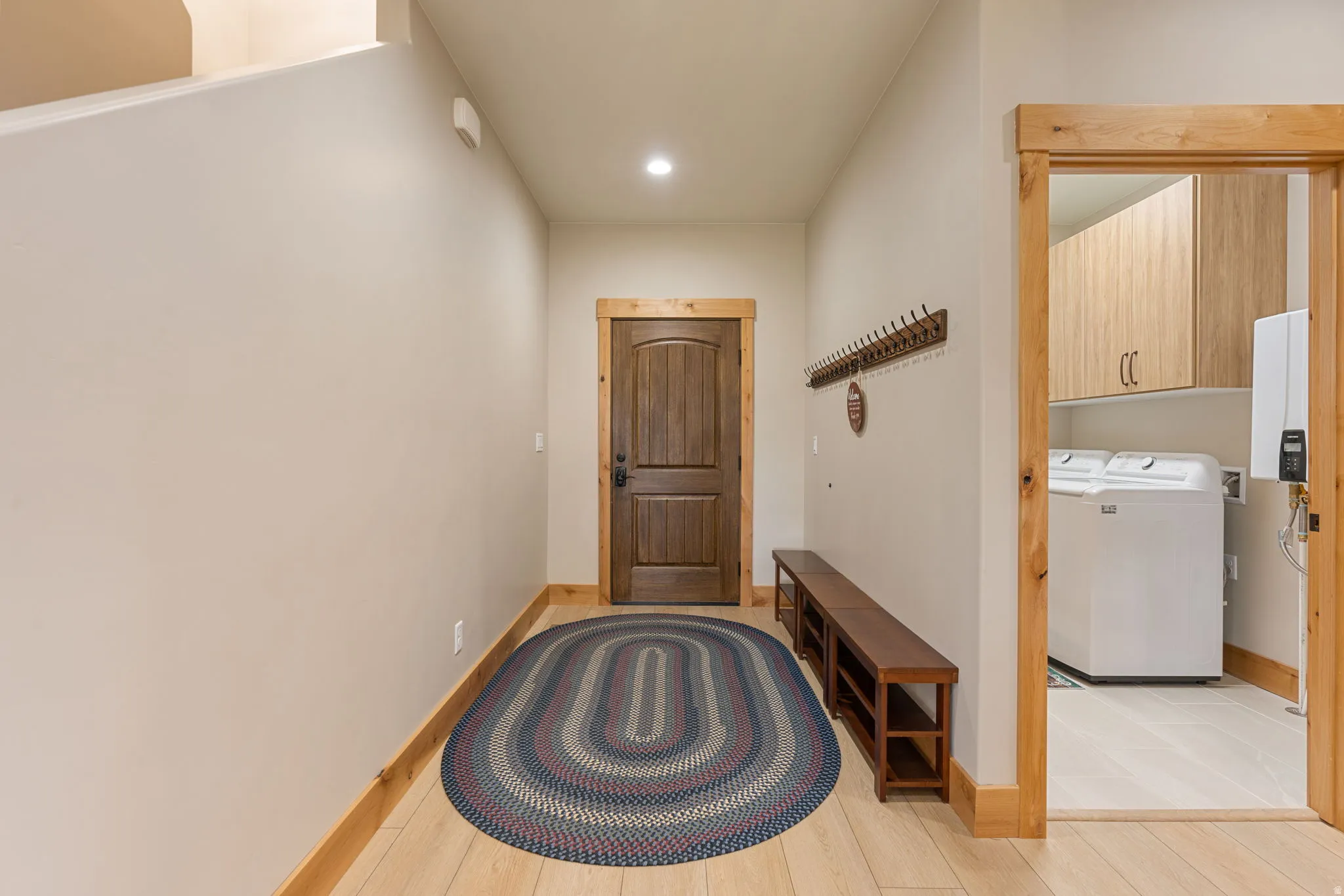 Wood-finish flooring with natural wood trim and solid core door