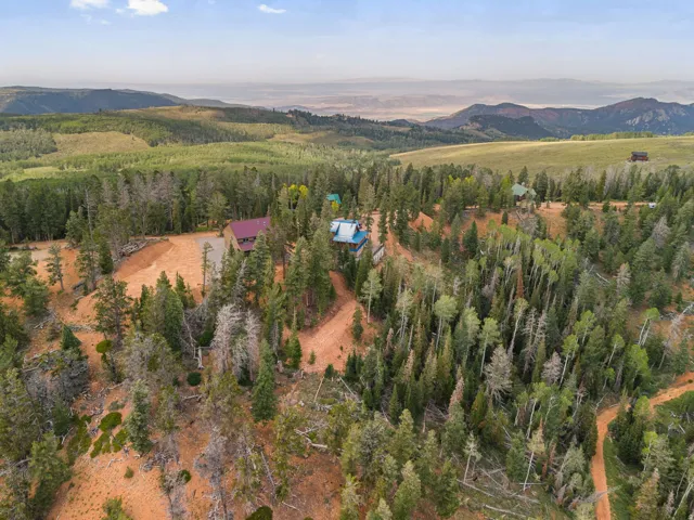 Expansive natural landscape with varied terrain and distant mountain ranges