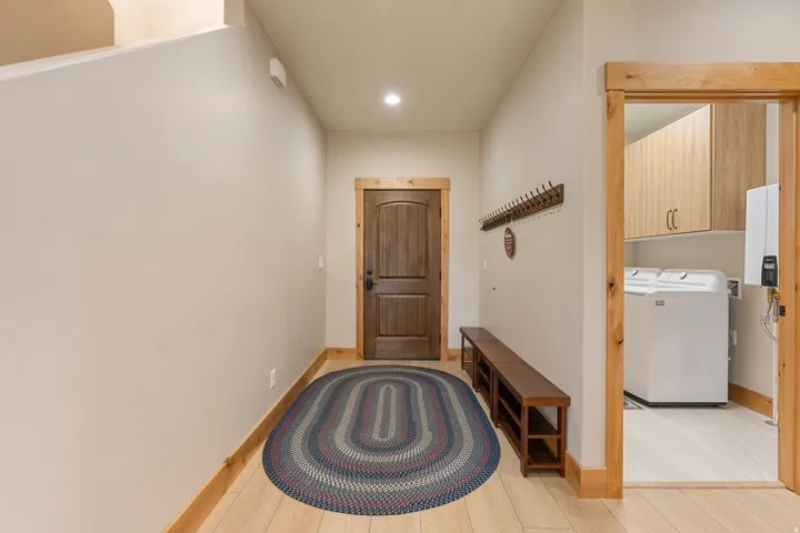 Wood-finish flooring with natural wood trim and solid core door