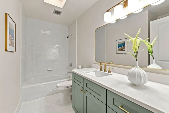 guest bathroom and laundry space, all newly remodeled with tasteful finishes