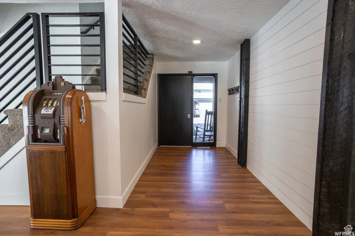Wood-finish flooring throughout, complemented by a white shiplap accent wall