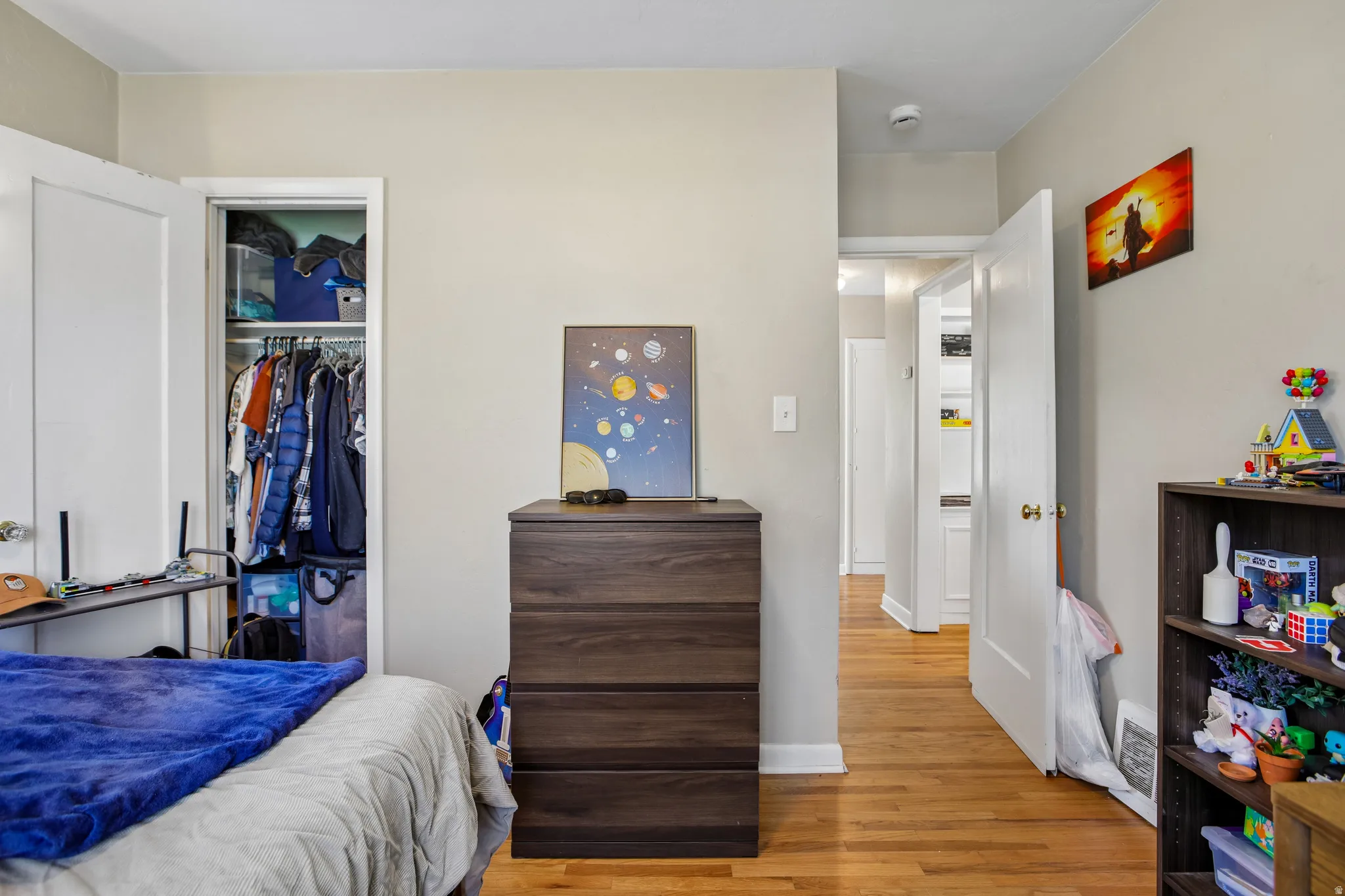 Hardwood flooring throughout the room and hallway