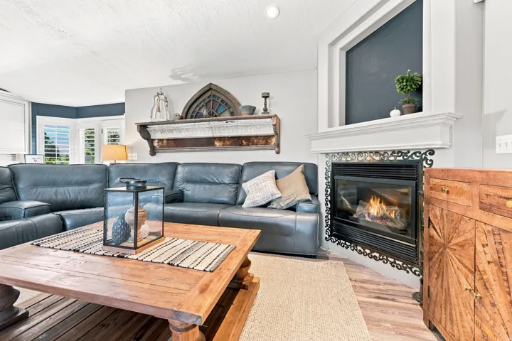 Corner fireplace with decorative tile surround and mantel