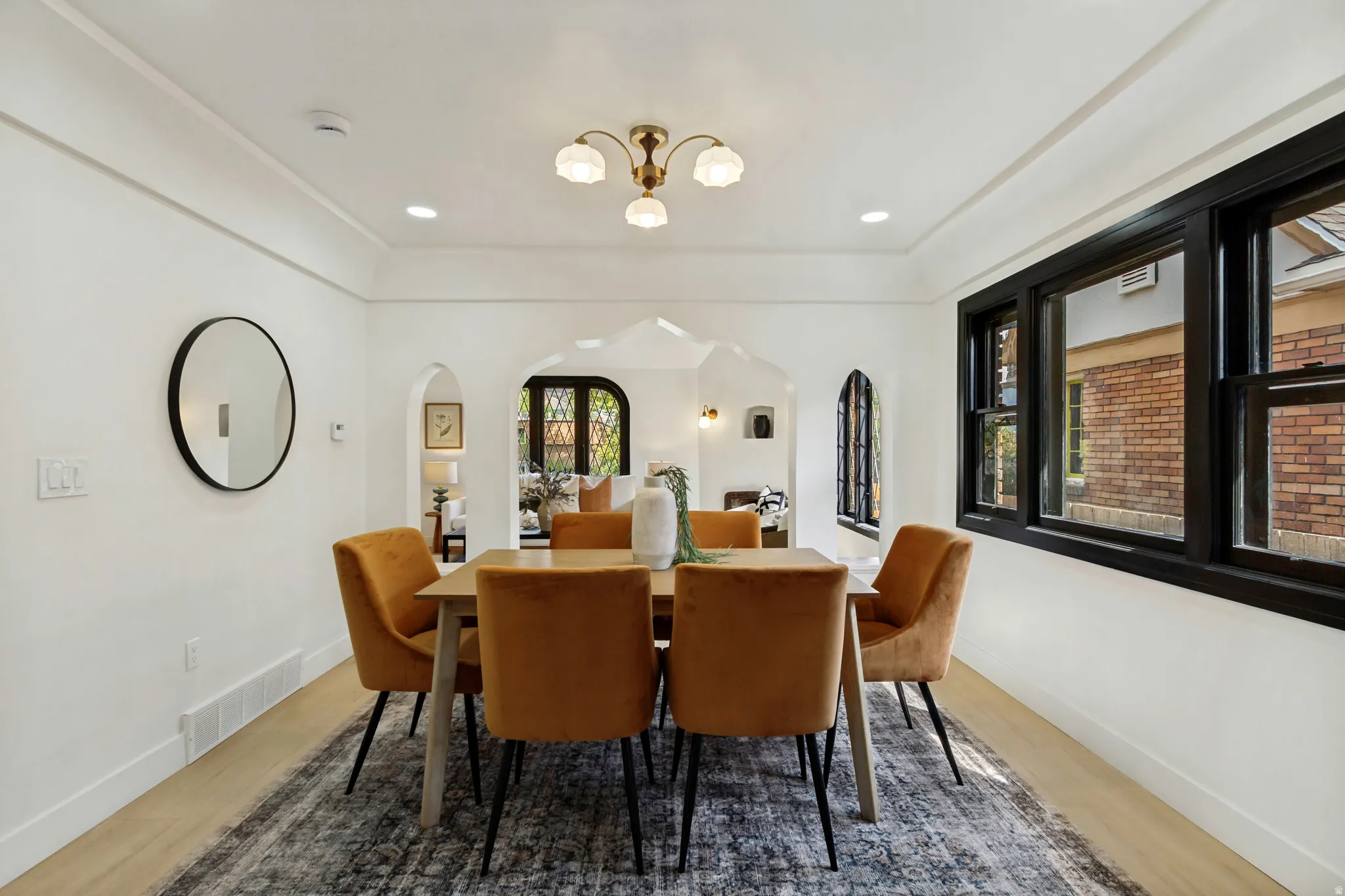 Hardwood flooring, recessed lighting, and crown molding