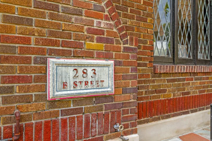 Brick exterior with decorative window grilles