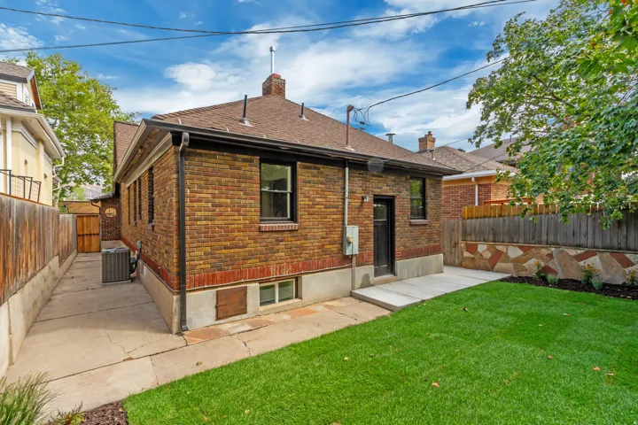 Brick exterior with a gabled roof and dark trim