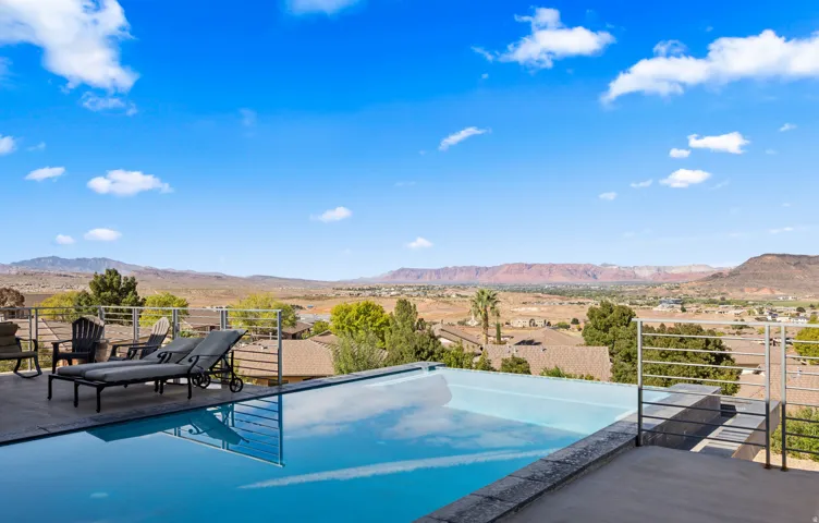 Infinity-edge pool with surrounding patio space