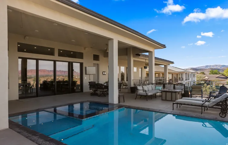Covered patio with an integrated swimming pool and spa