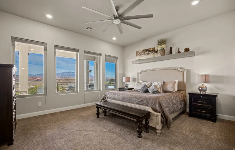 Recessed lighting, ceiling fan, and carpeted flooring
