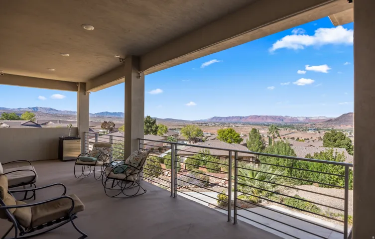 Covered patio with recessed lighting, concrete flooring, and stainless steel railing