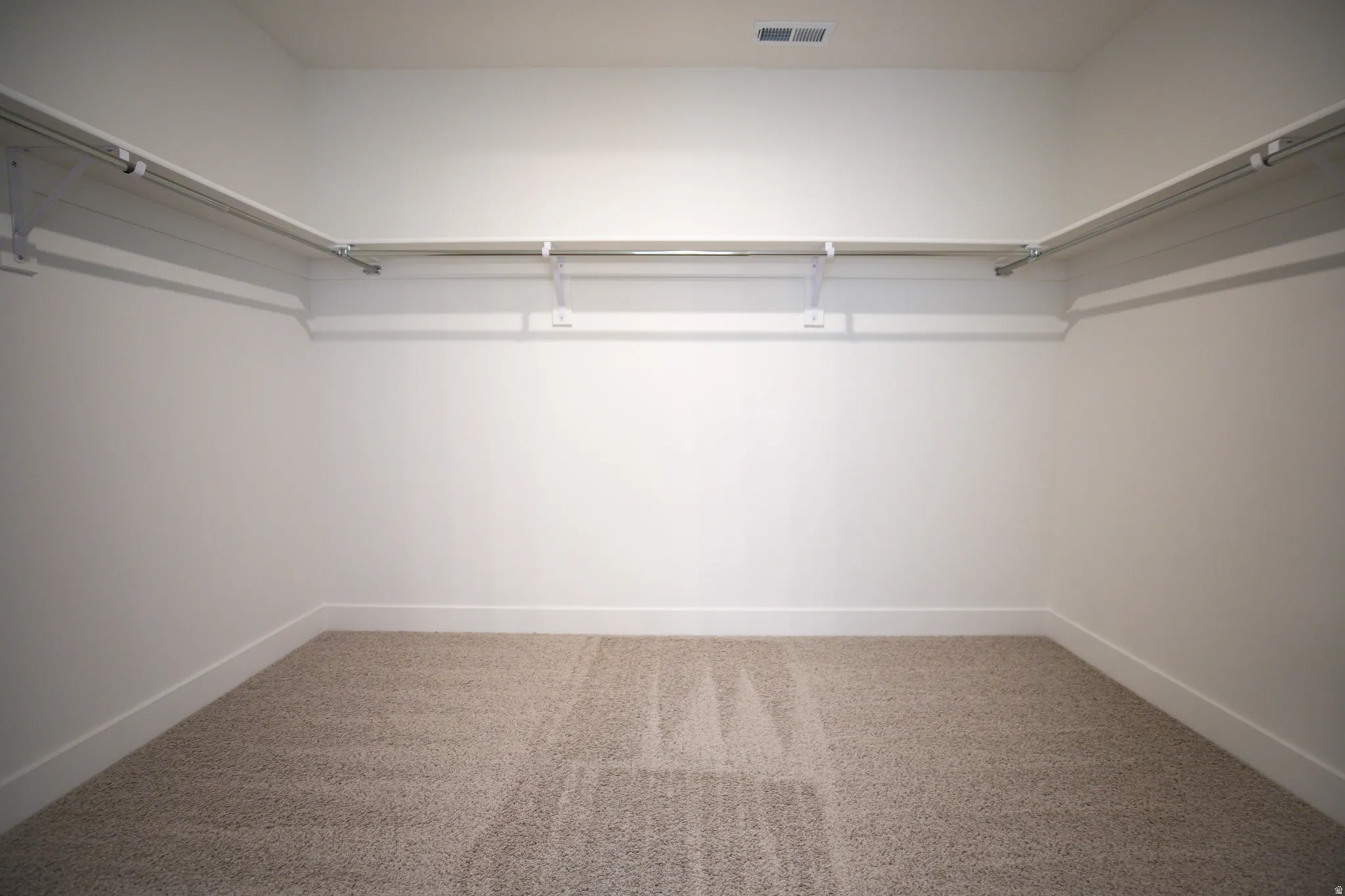 Large walk-in closet as part of primary suite.