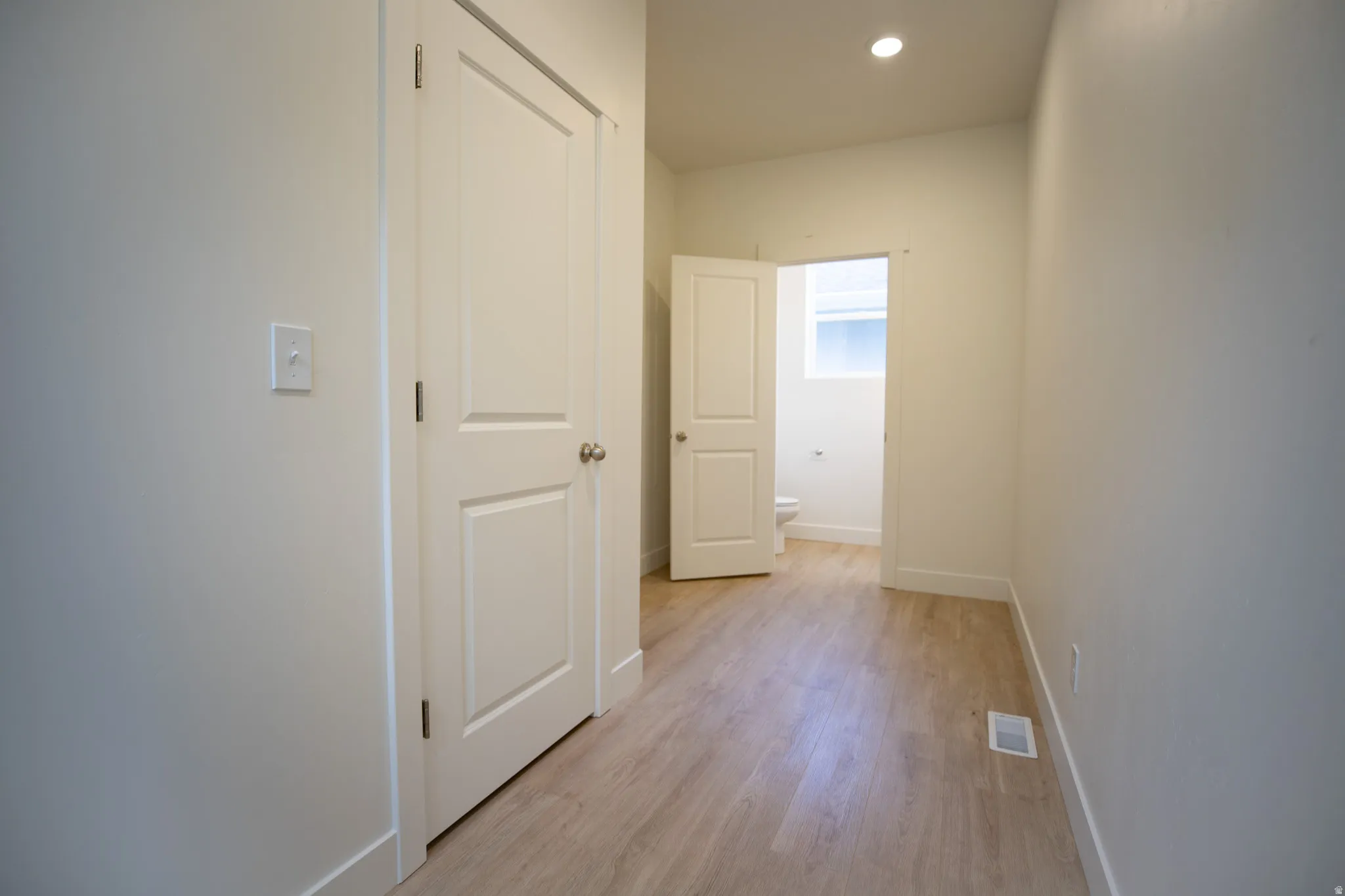 Powder bath and large closet next to garage entrance.