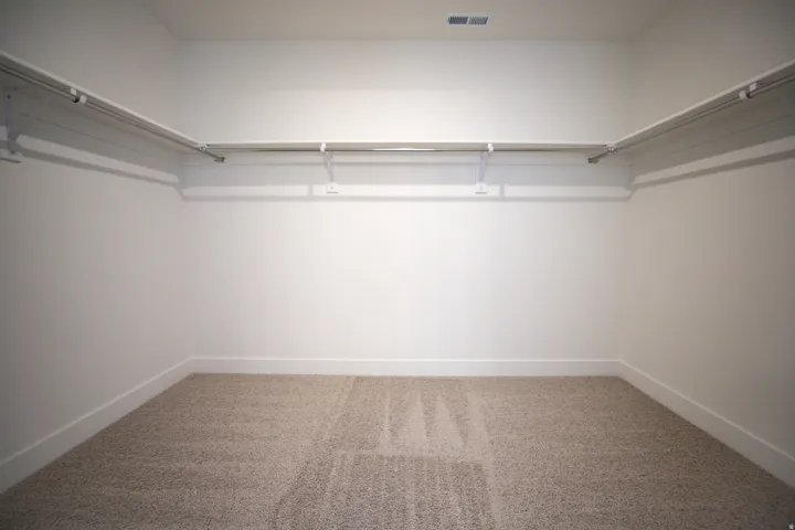 Large walk-in closet as part of primary suite.