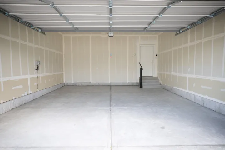Two car garage with taped finish.