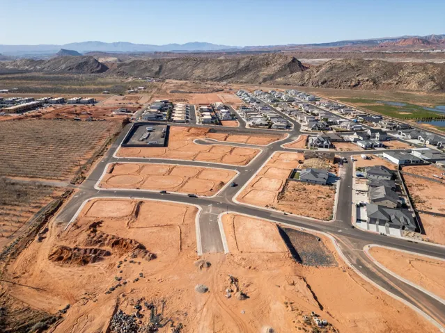 Developing residential community with established streets, graded lots, and completed homes