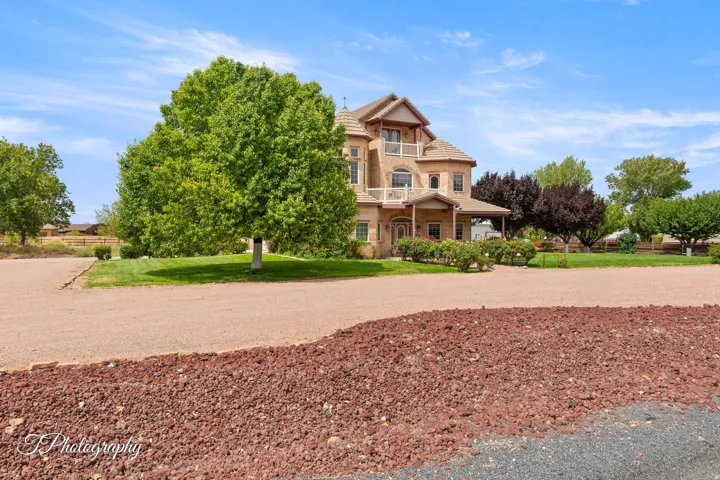 Classic two-story Victorian-style residence featuring a distinctive gabled roofline and arched entryway