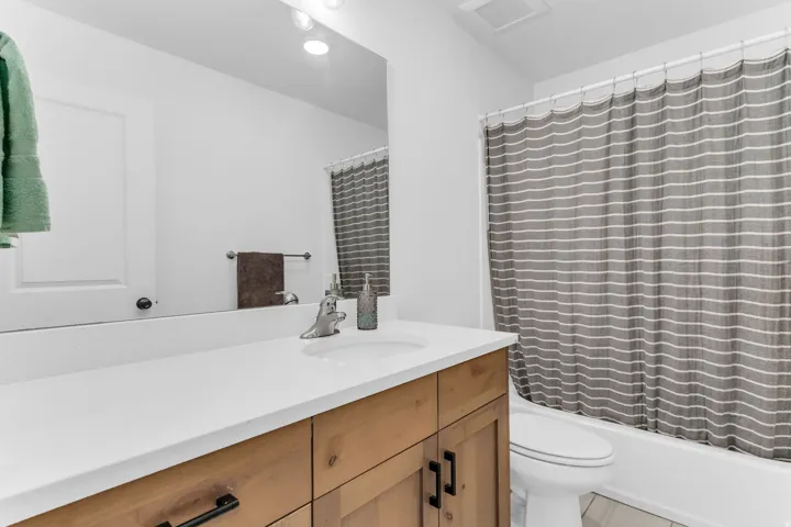 White countertop with an integrated sink and chrome faucet