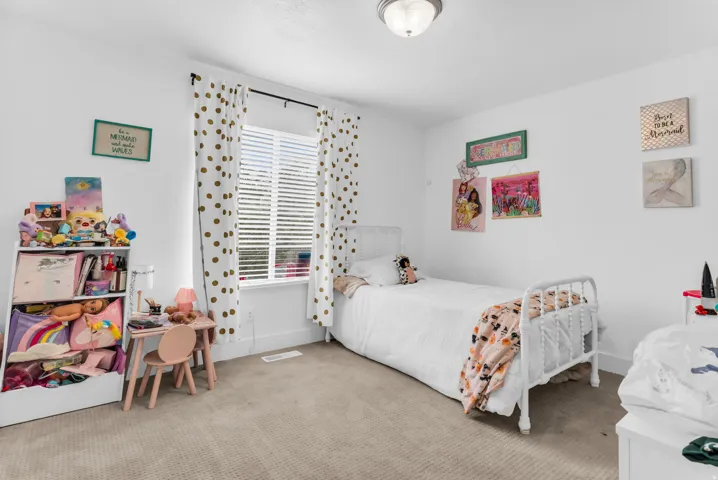 Carpeted flooring, white walls, window with blinds, and flush mount ceiling light fixture
