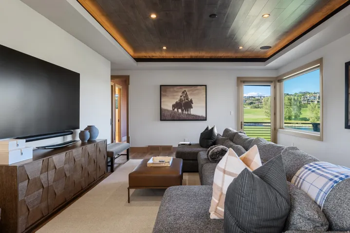 Wood-paneled ceiling with recessed lighting