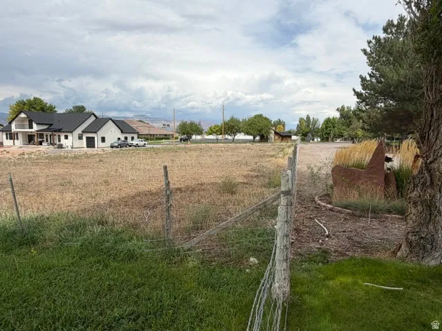Expansive undeveloped lot with existing perimeter fencing