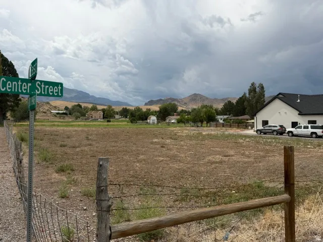 Expansive undeveloped land with a wire and wood fence