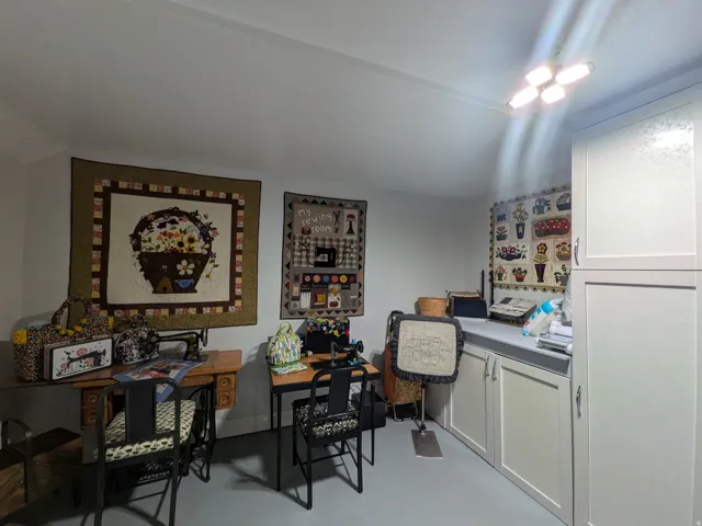 Built-in cabinetry with frosted glass upper doors, integrated countertop, and painted walls
