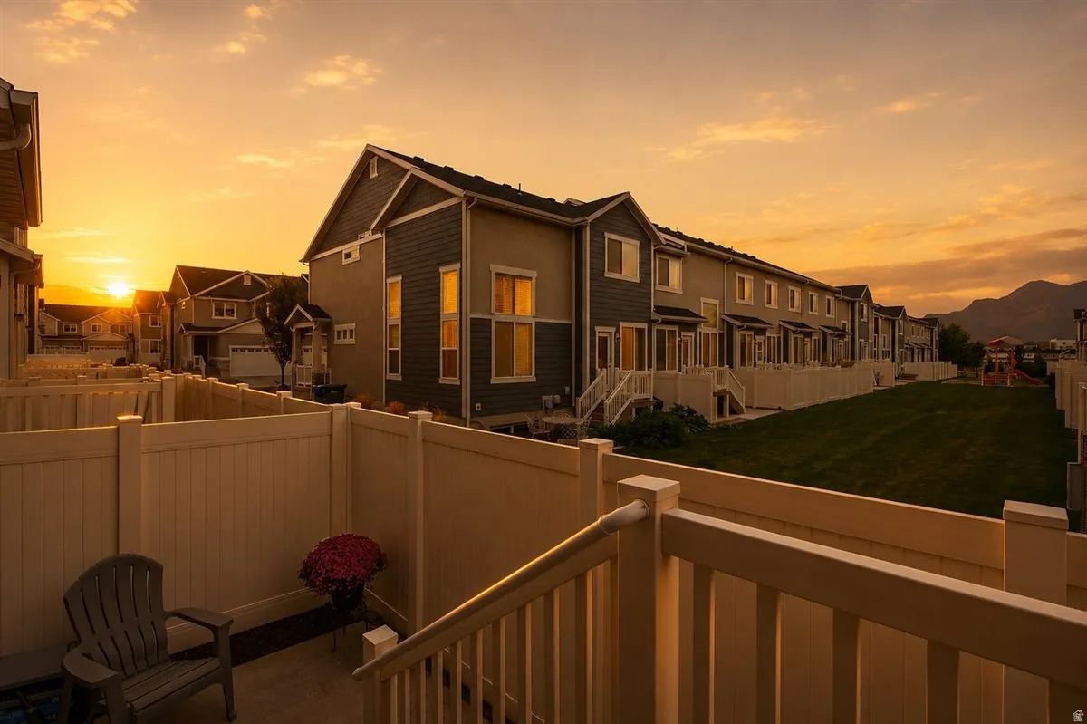 Private patio with light-colored fencing and railing