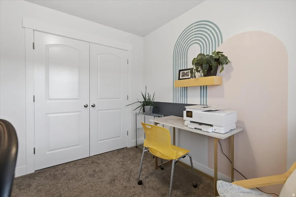 Wall-to-wall carpeting and white trim