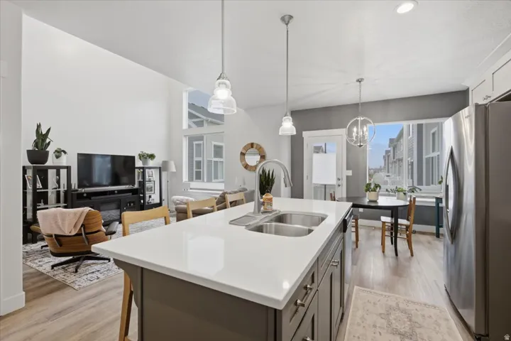 Kitchen island with a solid surface countertop and double basin sink