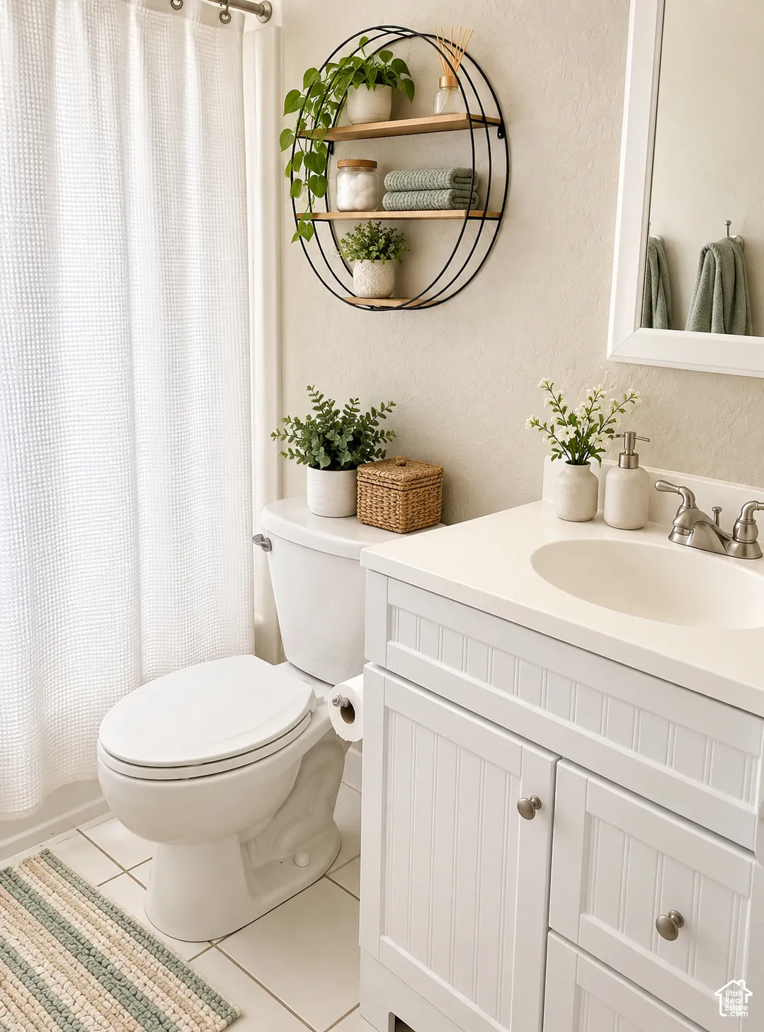White beadboard vanity with an integrated sink and brushed nickel faucet