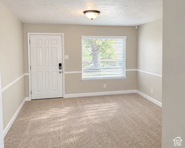 Neutral tone wall paint with decorative chair rail molding
