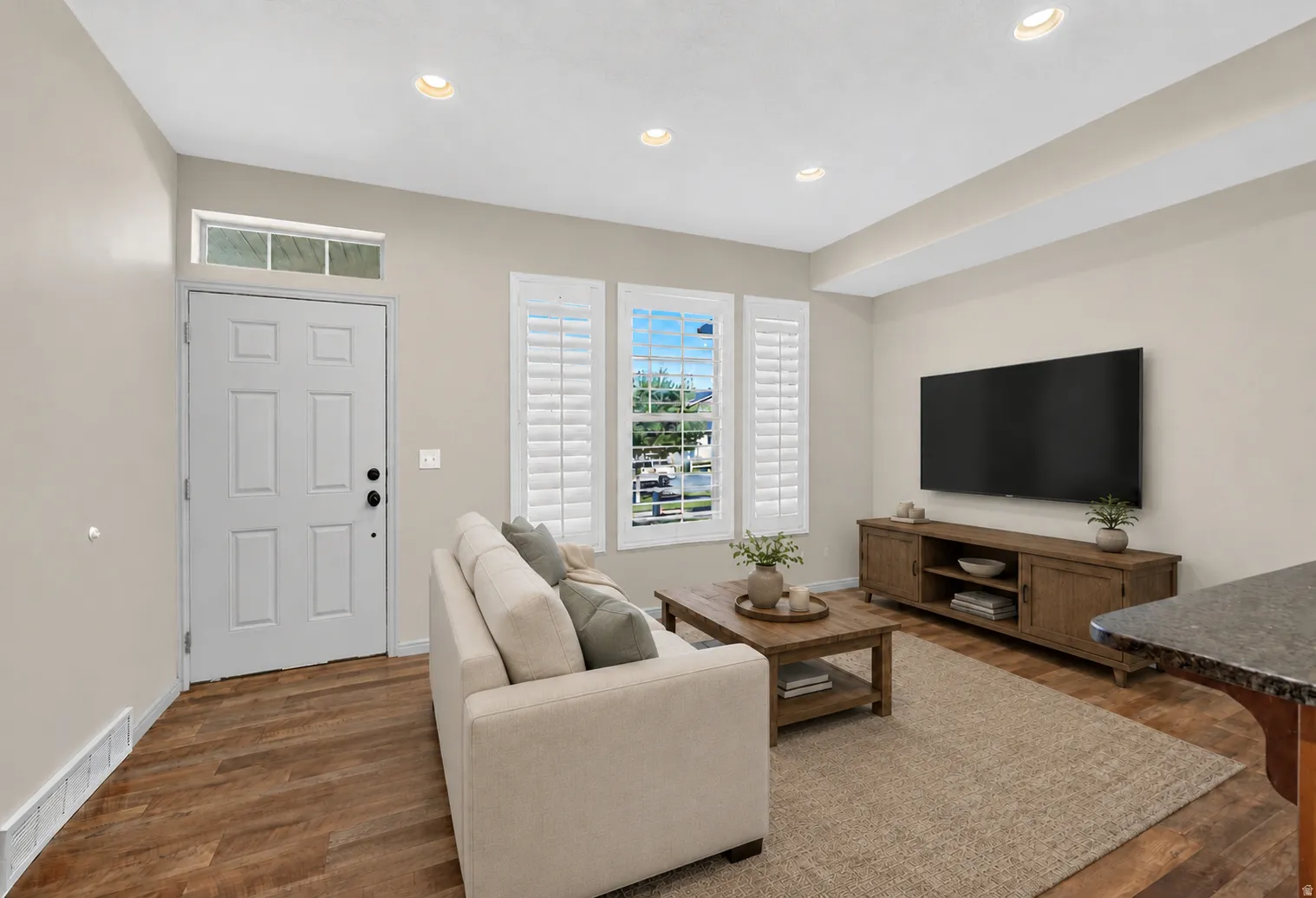 Recessed lighting and wood-finish flooring