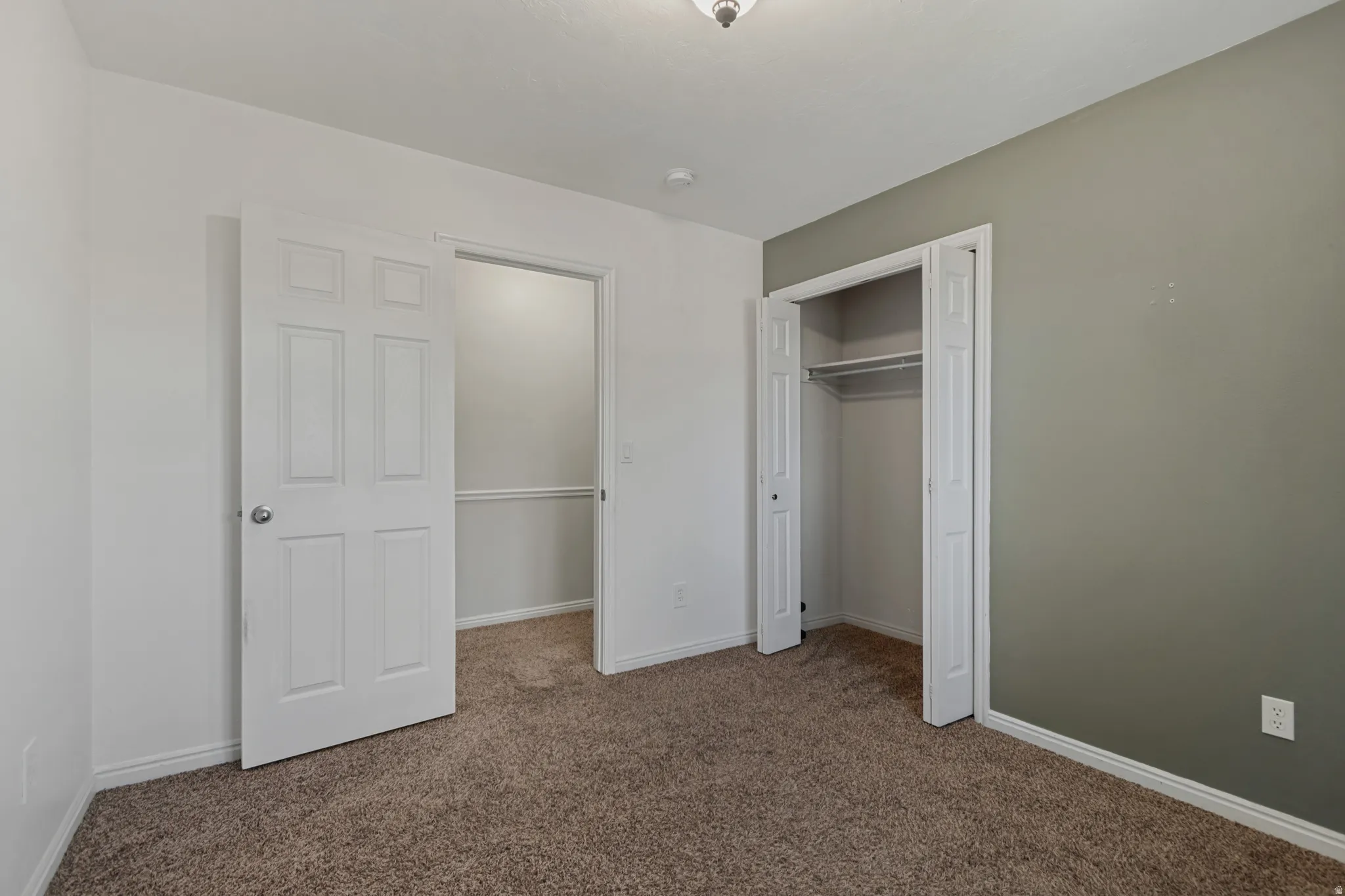 Upstairs unstaged bedroom