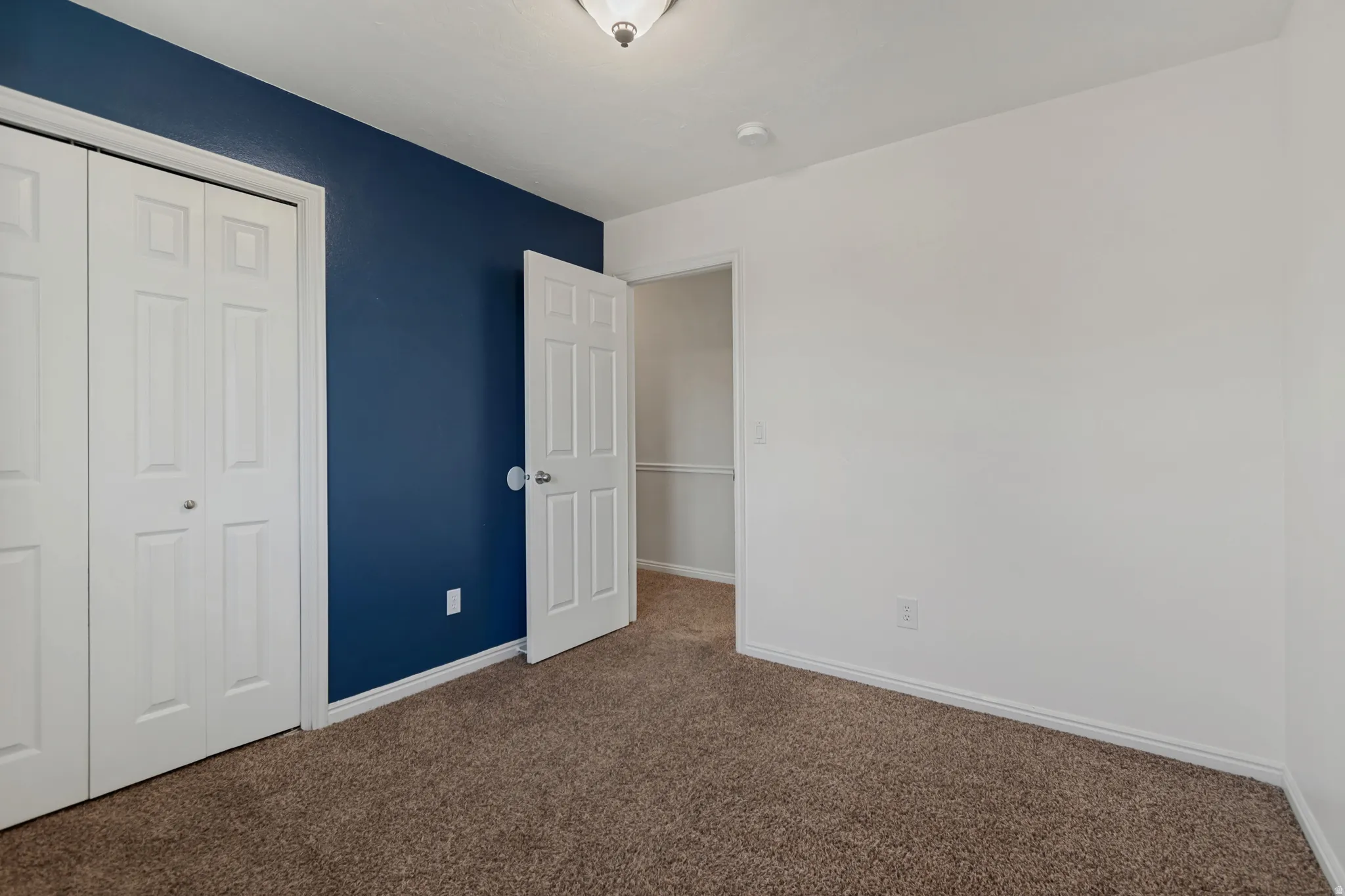 Upstairs unstaged bedroom