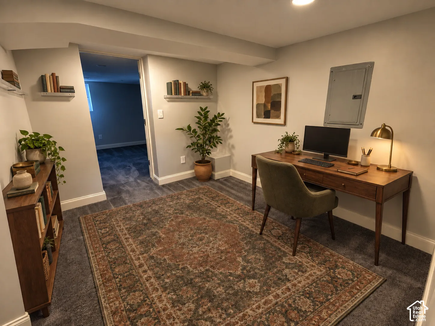 Recessed ceiling lighting, wall-mounted shelving, neutral wall paint, and gray carpet flooring
