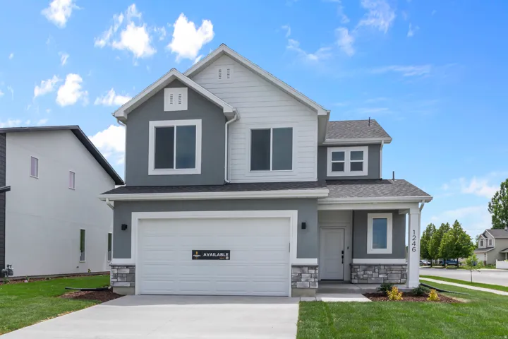 Traditional Elevation: This is an example of a previously built home, exact finishes will vary.