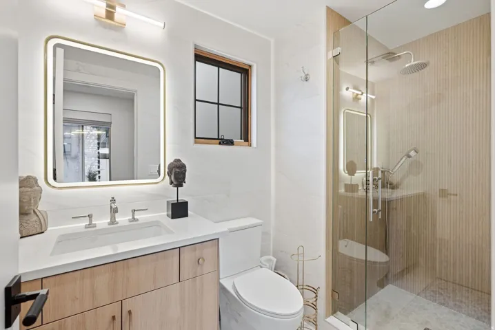 Natural wood-finish vanity with an integrated sink and countertop