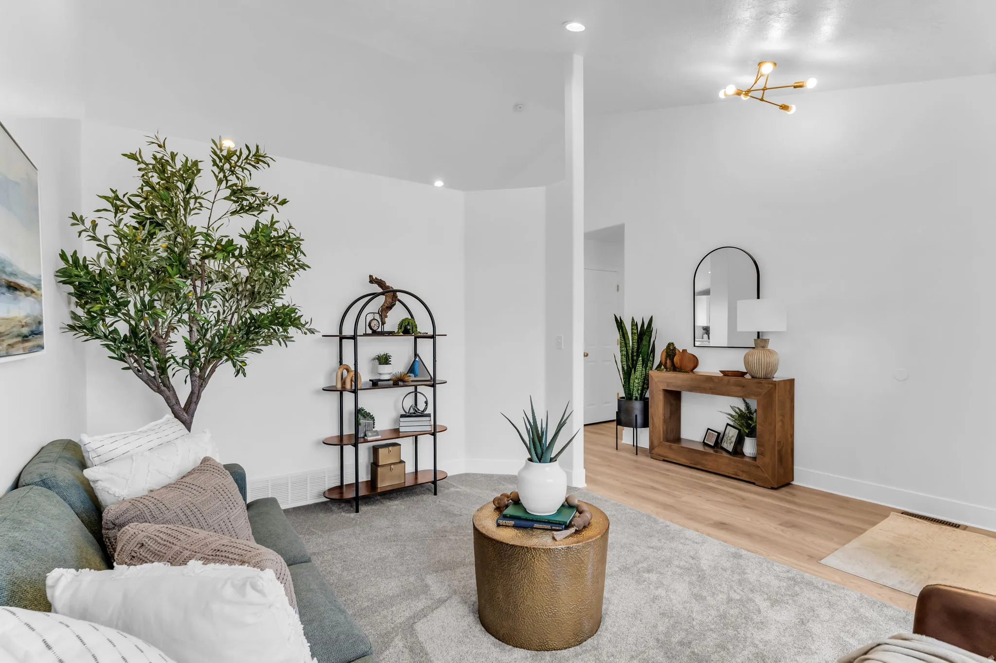 Recessed lighting, wood-finish flooring, and a contemporary ceiling fixture