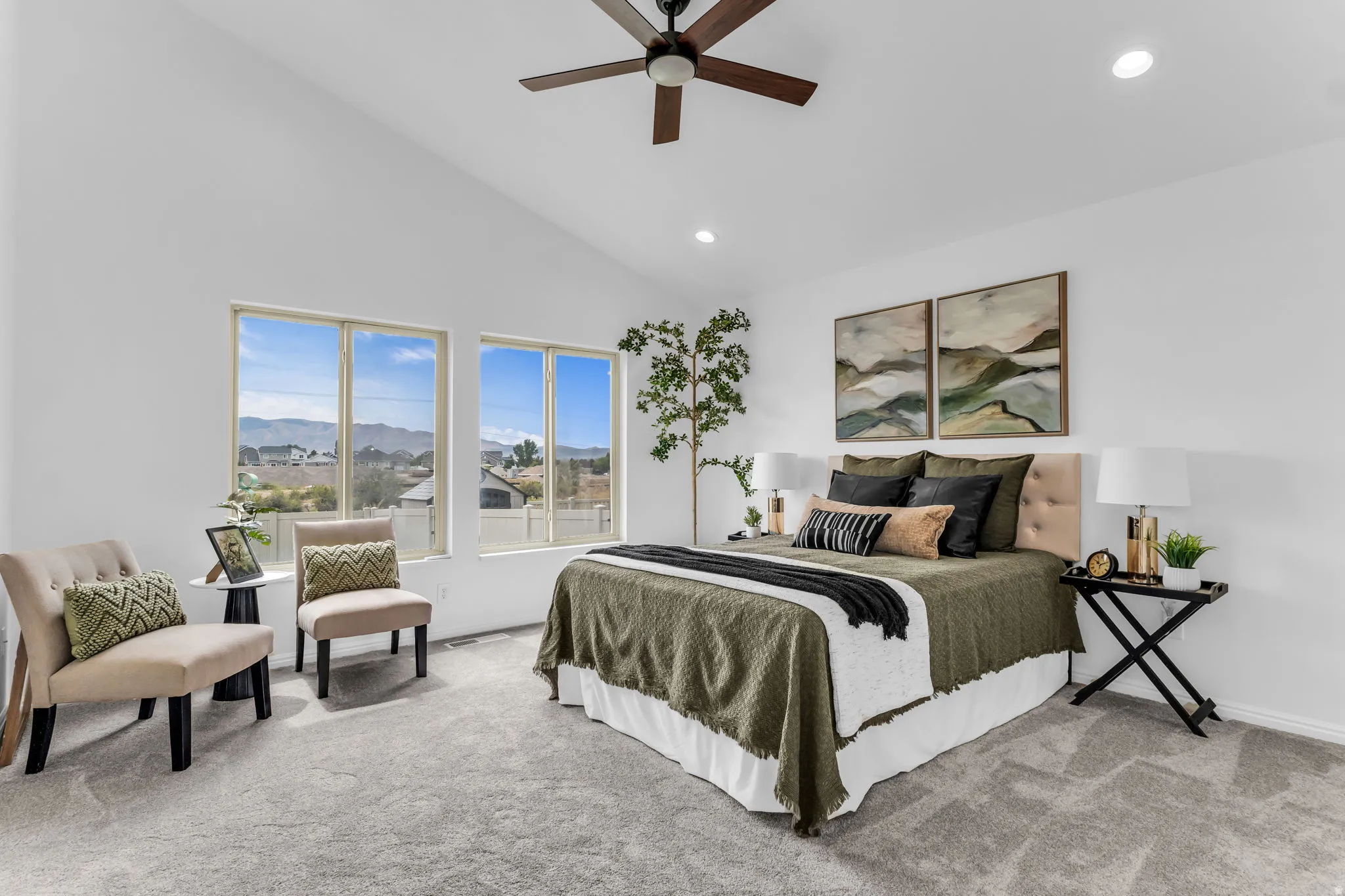 Vaulted ceilings with recessed lighting, ceiling fan, carpeted flooring, and multiple windows