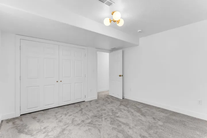 Plush gray carpeting and white walls