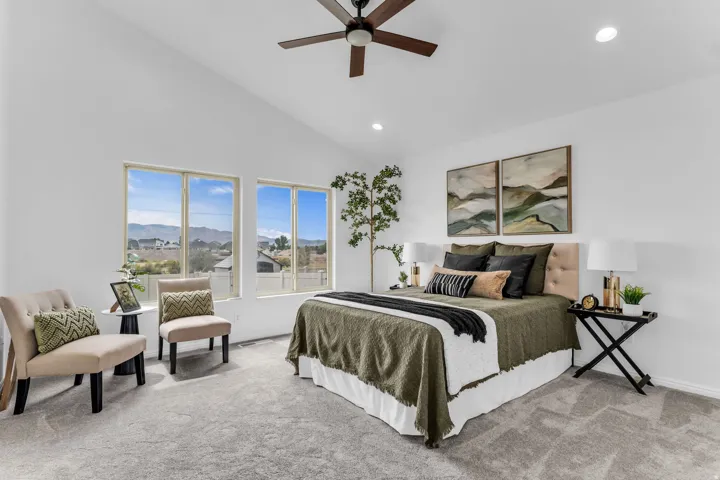 Vaulted ceilings with recessed lighting, ceiling fan, carpeted flooring, and multiple windows